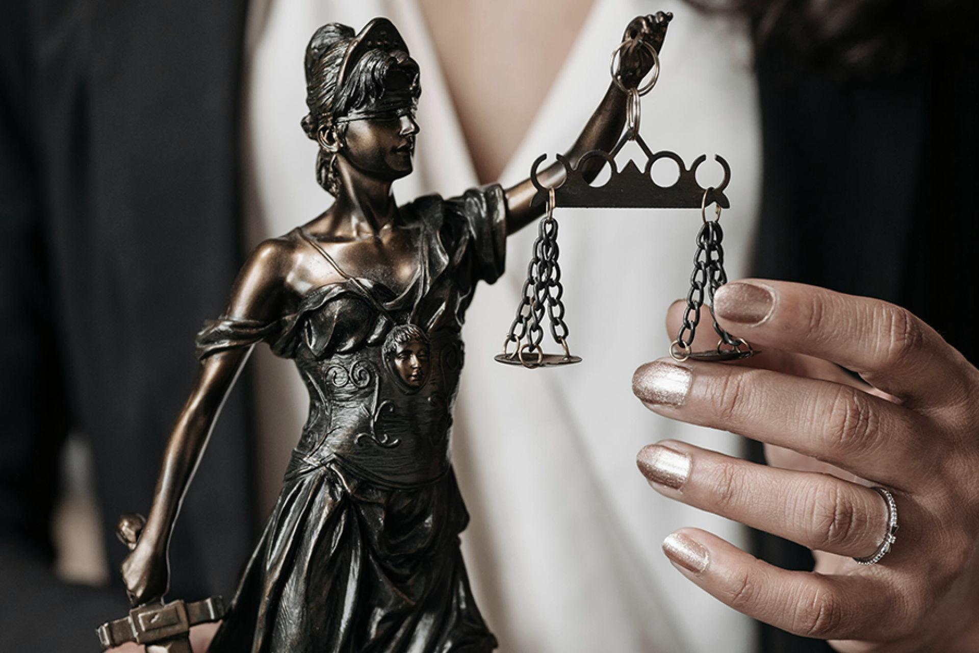 Woman holding Lady Justice