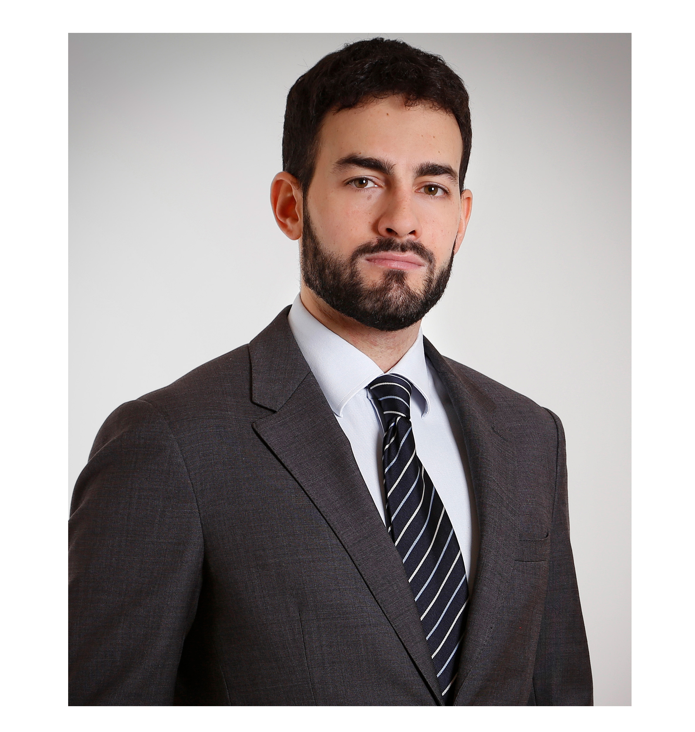 Dr de Stefano has dark hair and looks directly into the camera. 