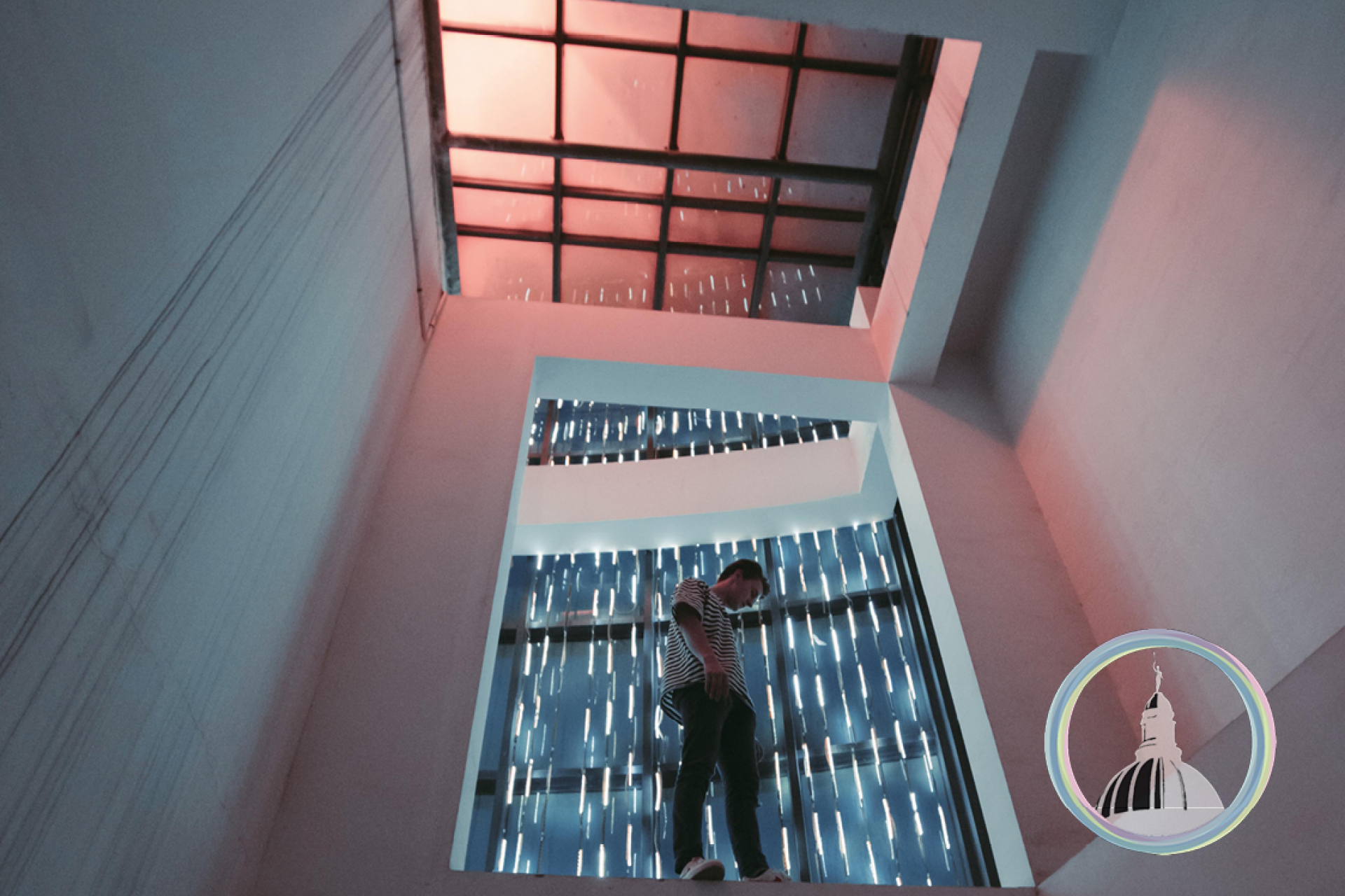 Man on ledge - lights in background
