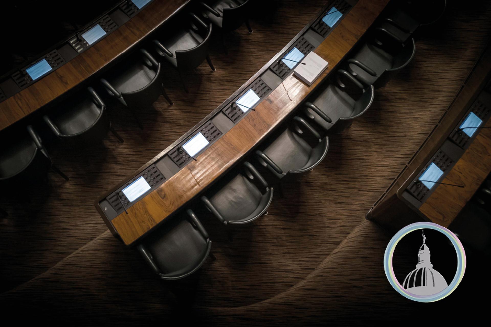 Low light image of courtroom chairs