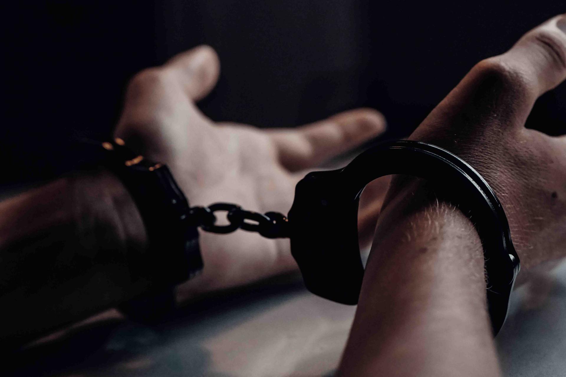 Hands in handcuffs