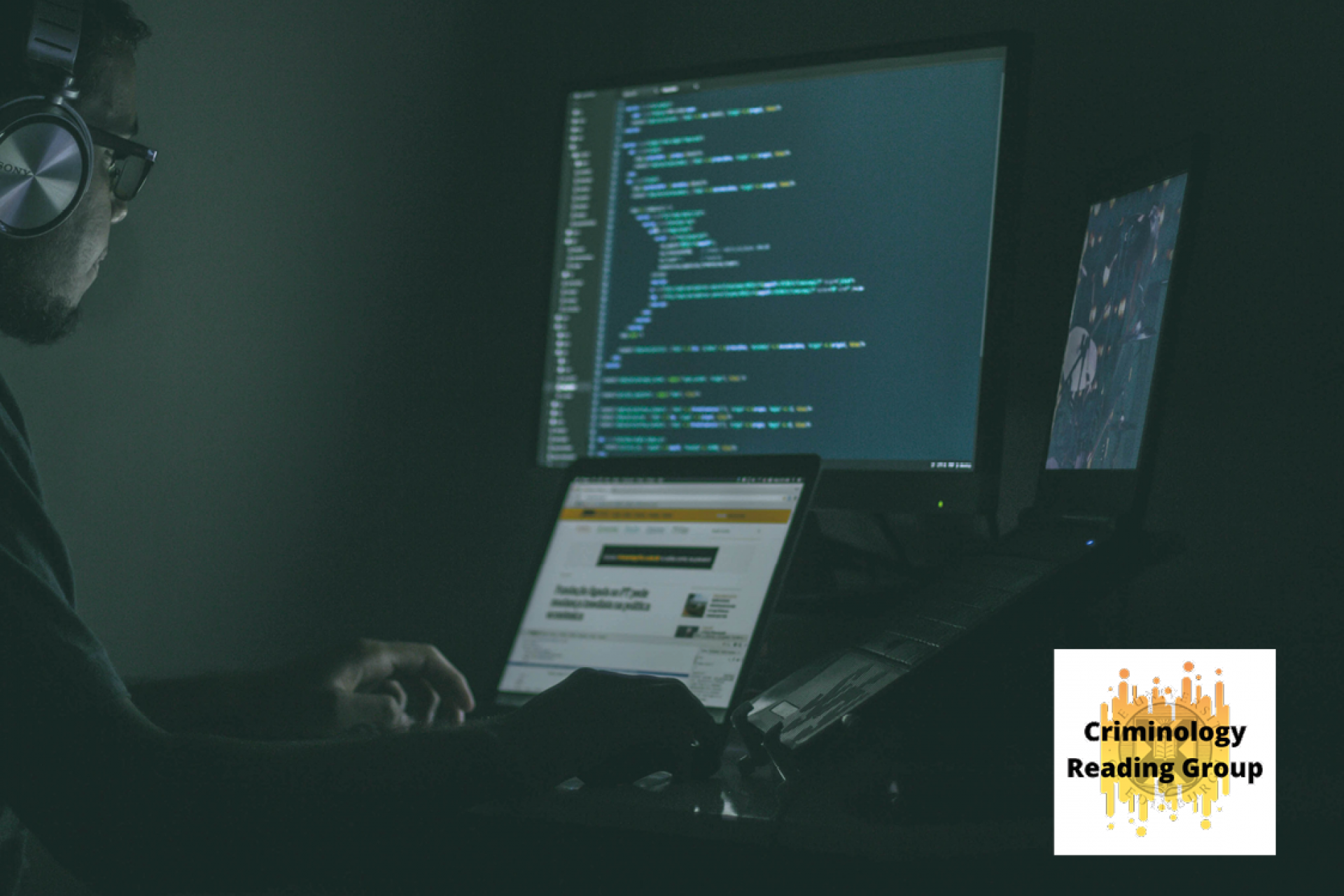 Man sitting at computer in the dark