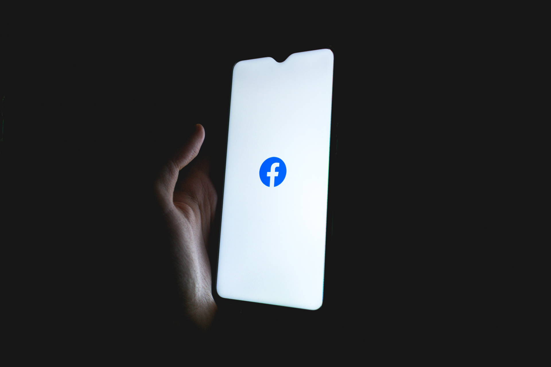 Phone with Facebook Logo on white screen