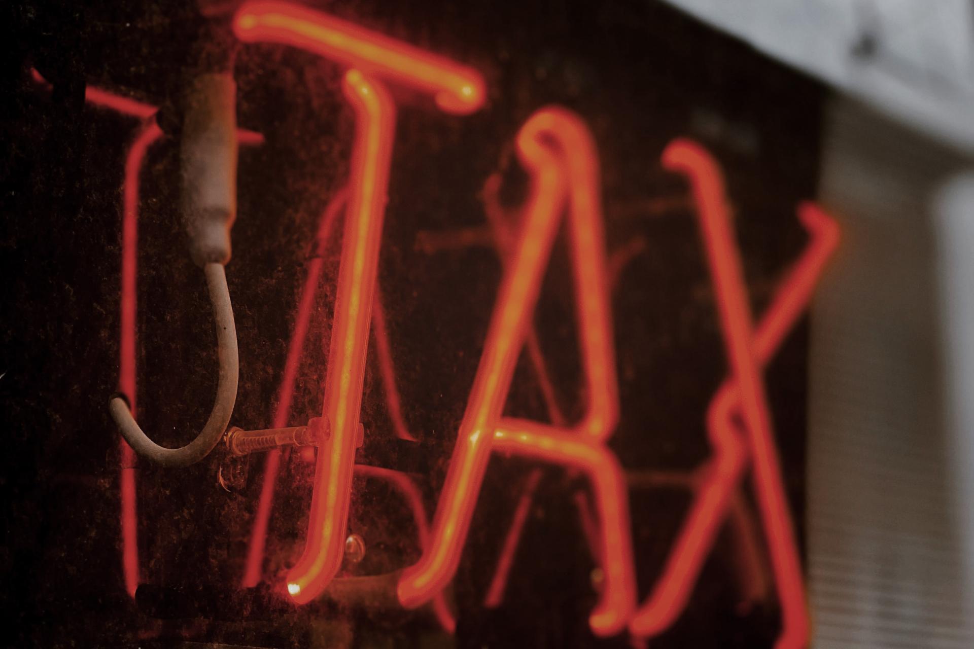 Red neon Tax Sign
