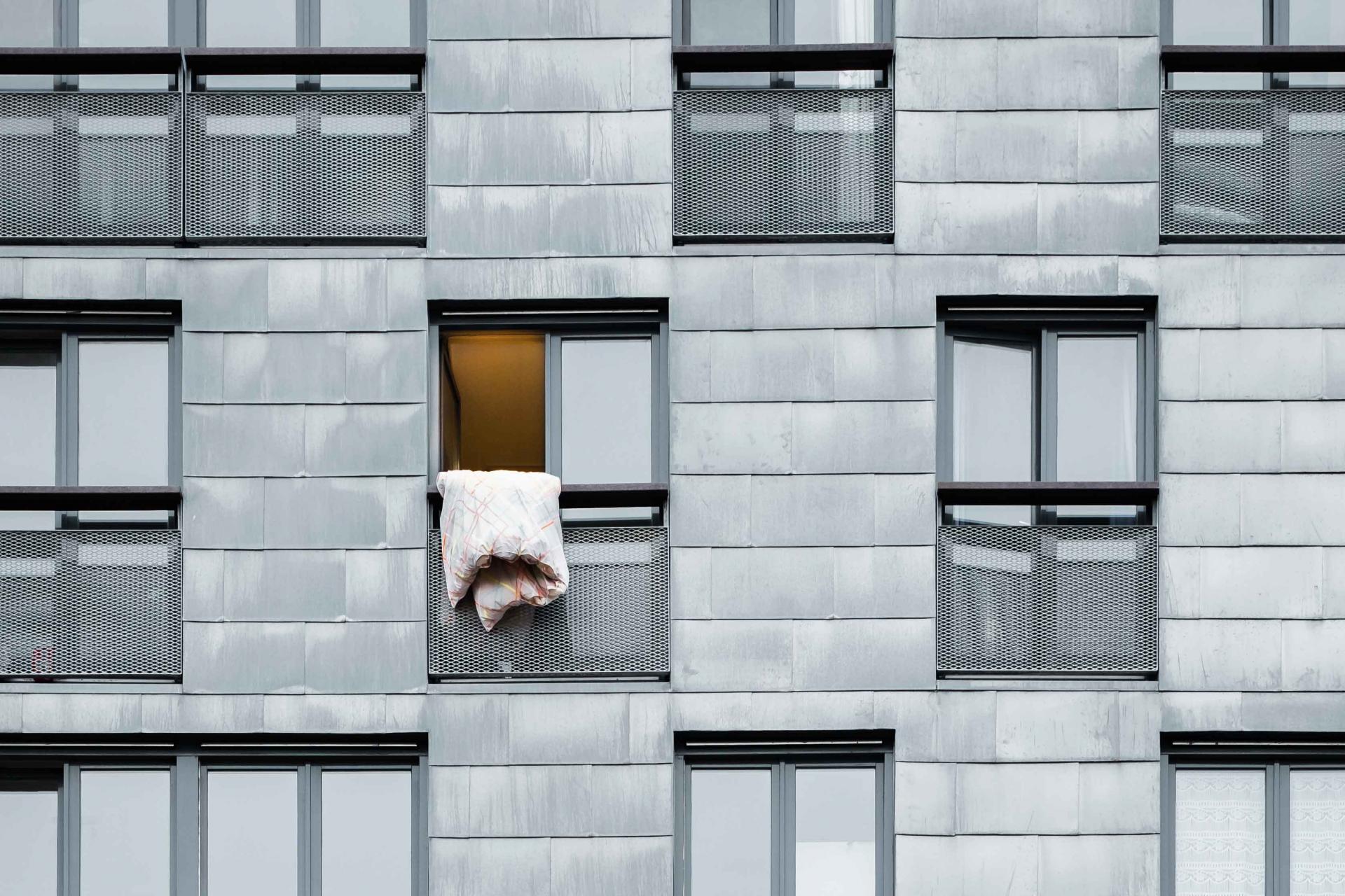 duvet hanging out hotel window