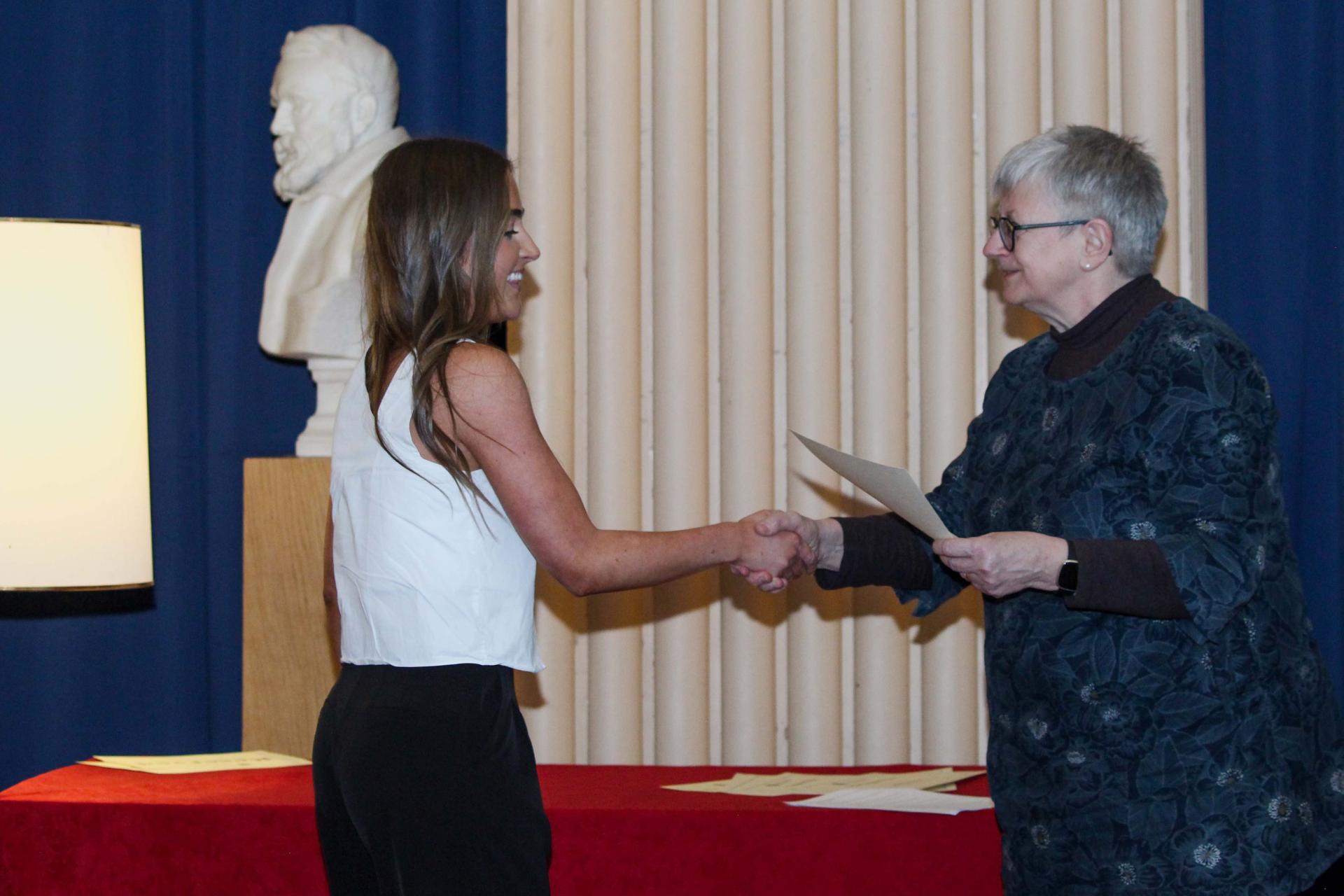 Award Winner Anna Rea accepting their certificate 