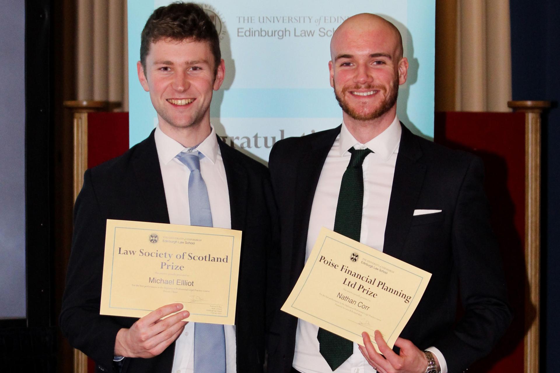 Michael Elliot and Nathan Corr smiling with their awards