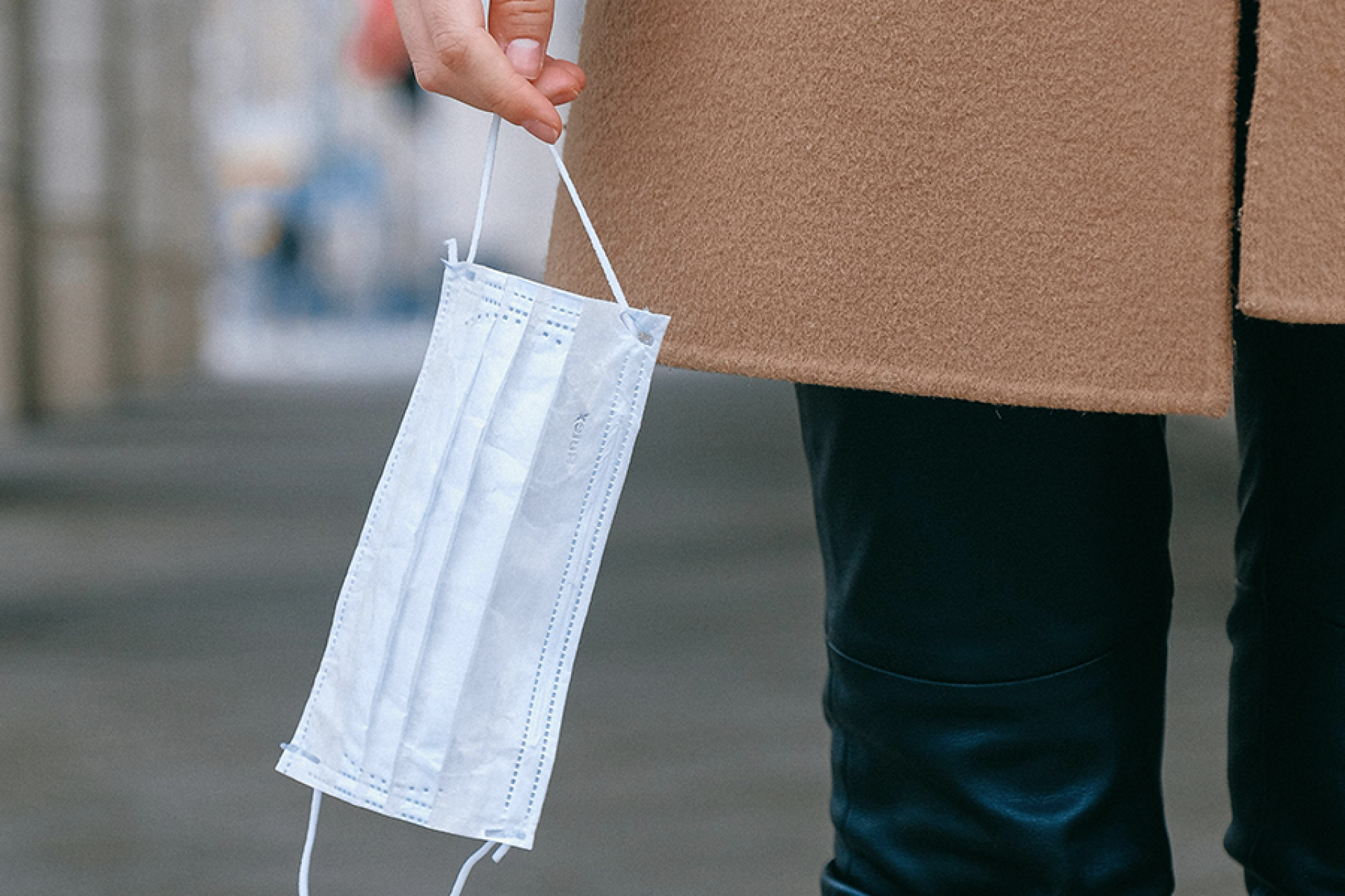 Person holding a face mask