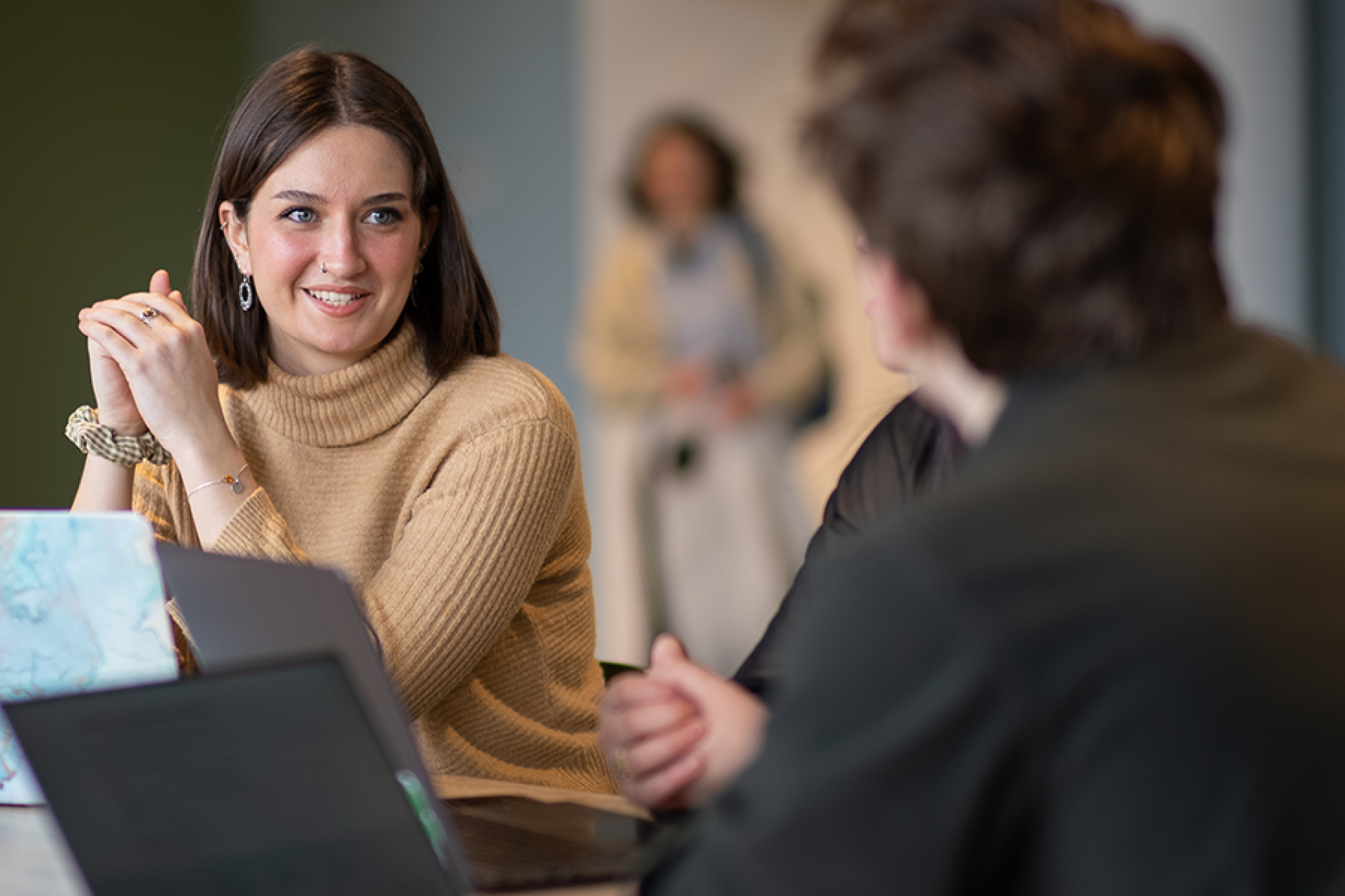 Students sitting with their laptops