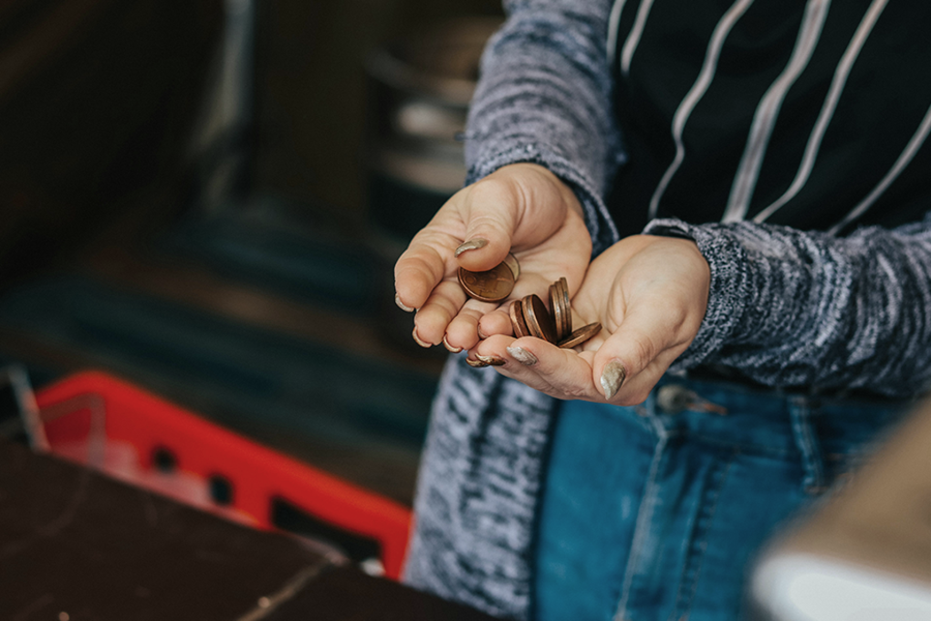 Person holding coins in hands