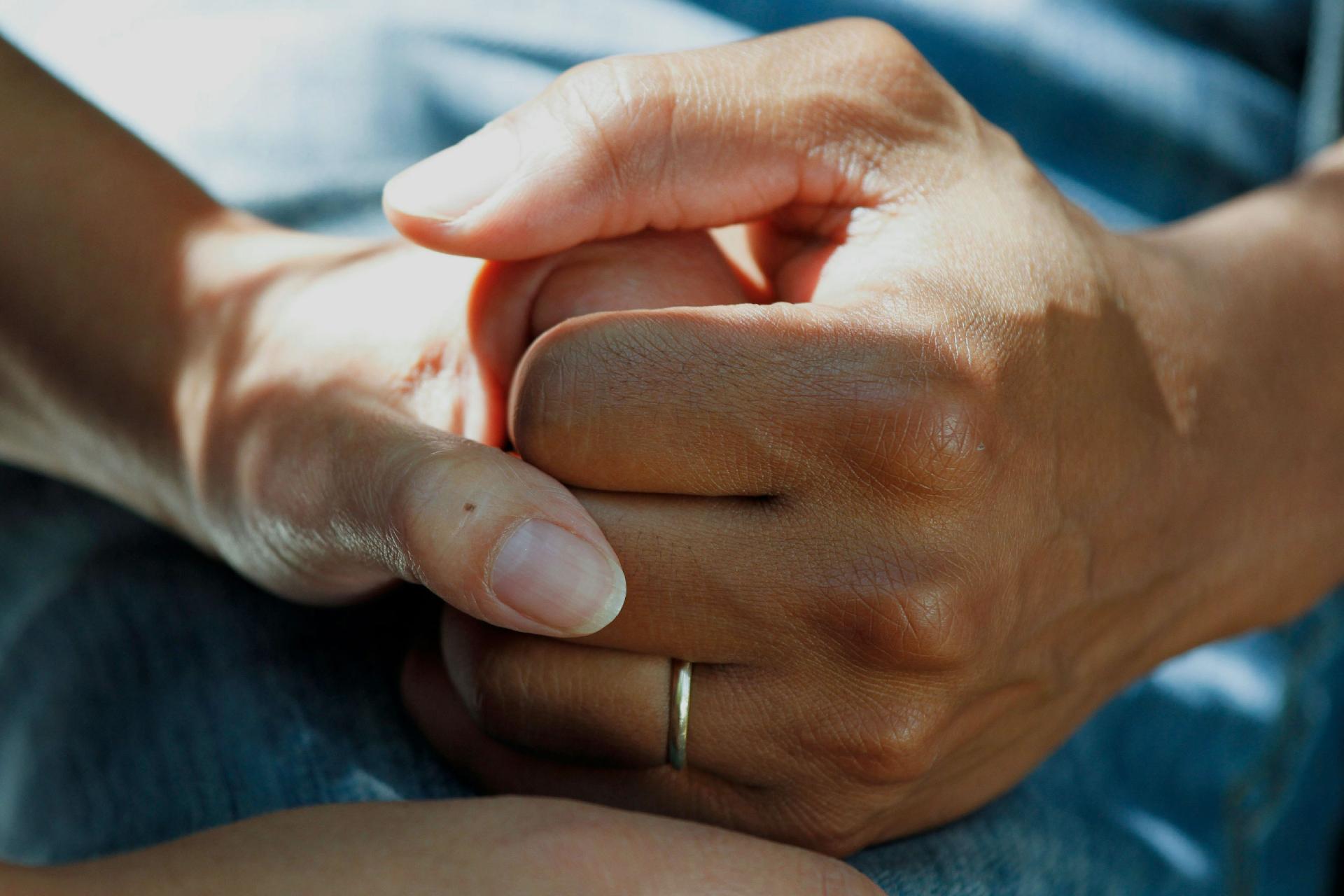 a hand holding another hand