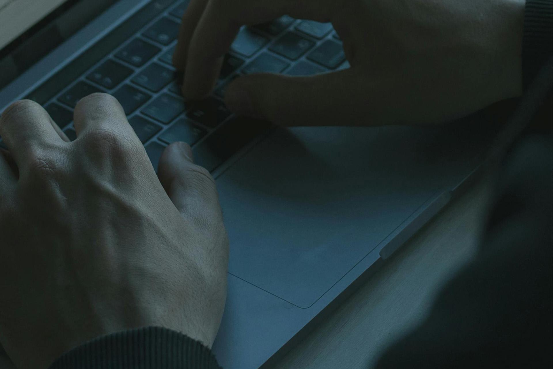 Hands on laptop keyboard