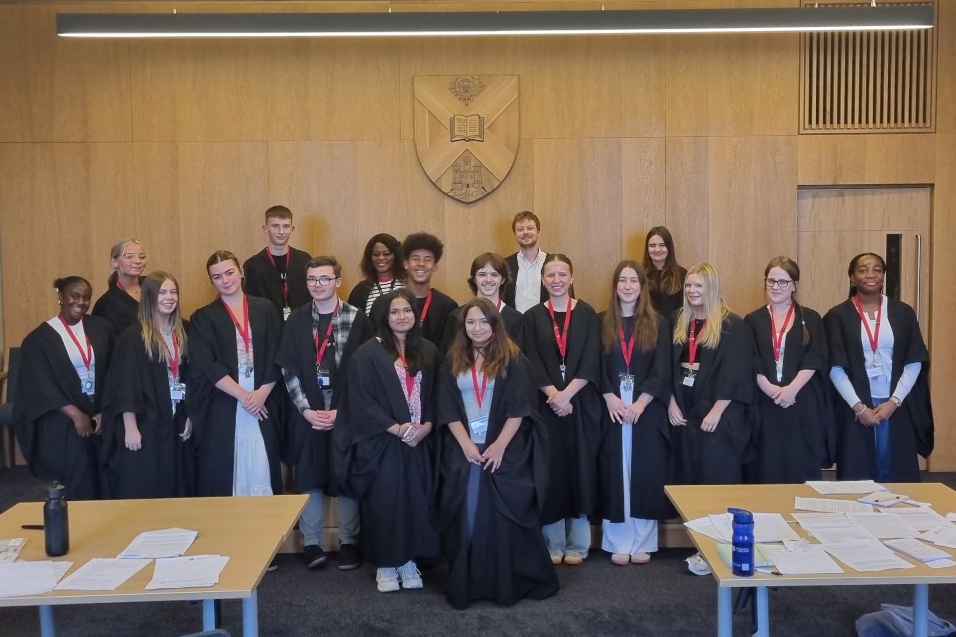 Group of students stood in Moot Court Room