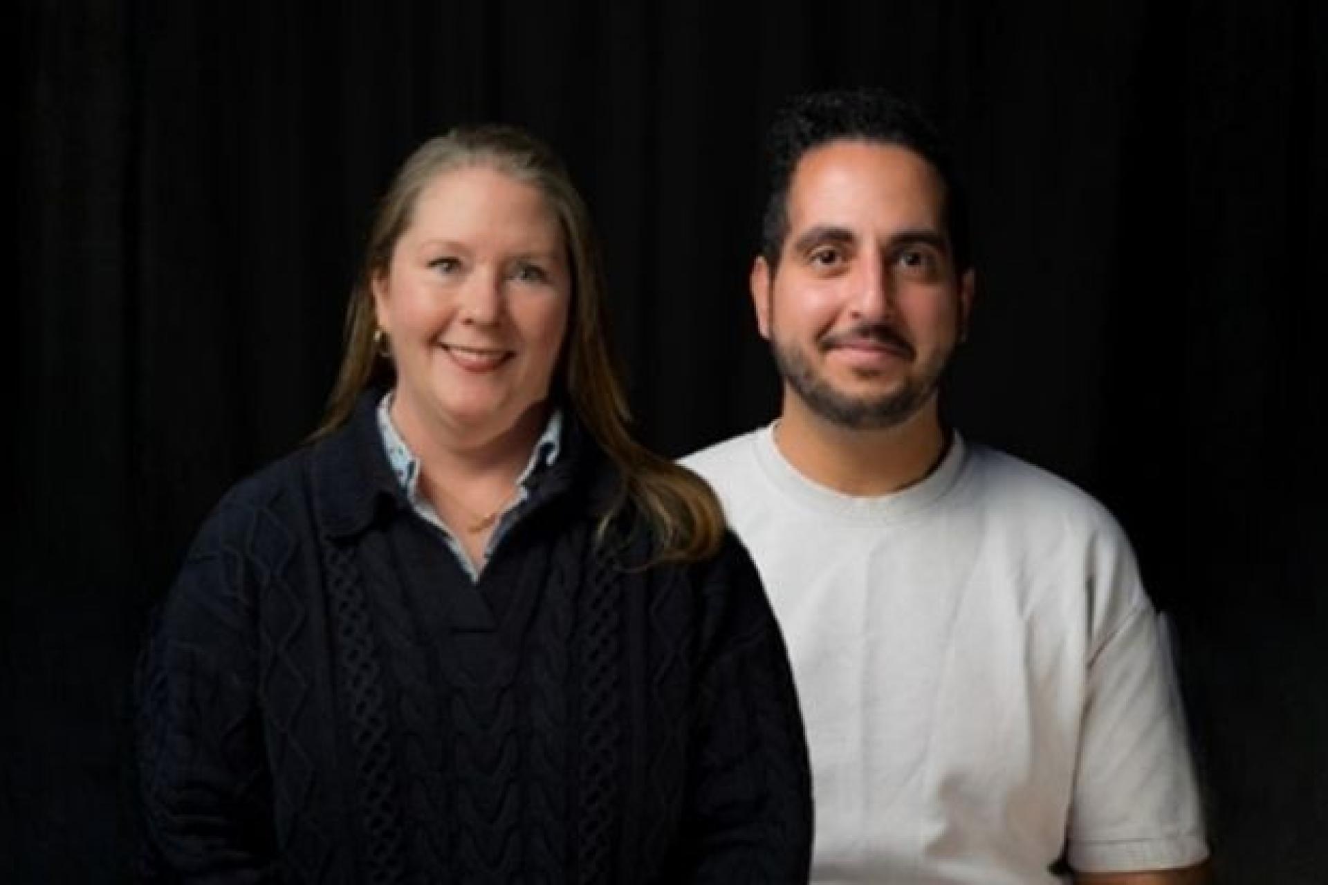 Neurobiologist John Girgis and Professor Kasey McCall-Smith stand smiling into the camera. 