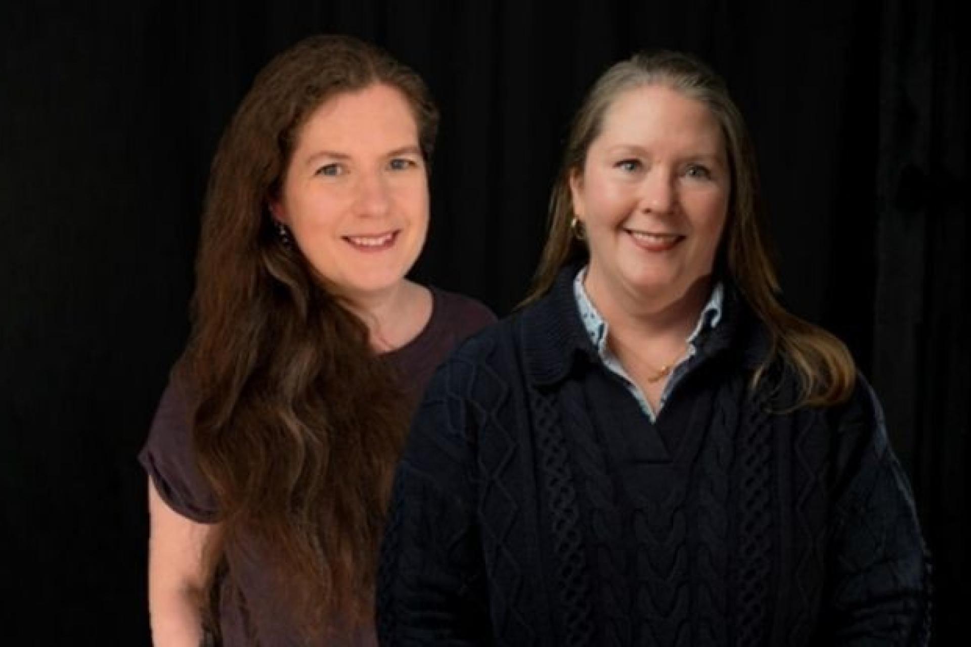 Dr Bryony Buck and Professor Kasey McCall-Smith smile into the camera. 