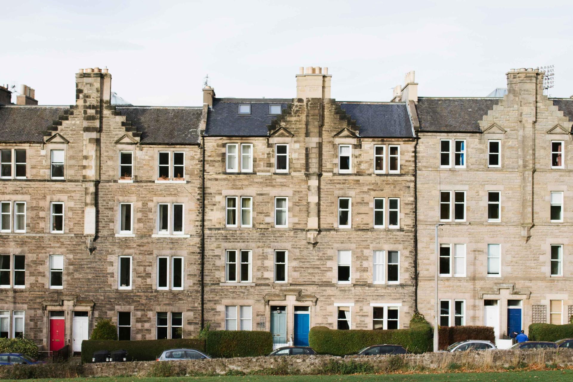 a row of houses with colourful doors