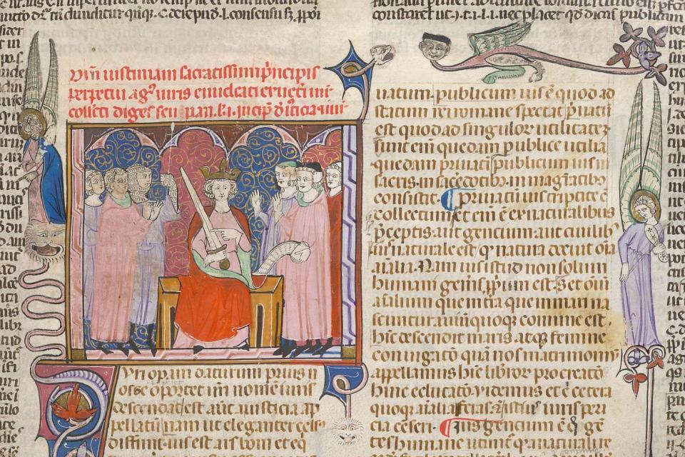 Miniature of the Emperor Justinian with a sword, surrounded by several figures, a decorated initial 'I'(uri) developing a full border with angels, dragons, rabbits and dogs, at the beginning of Justinian's Digestum Vetus, British Library, MS Arundel 484, f. 6